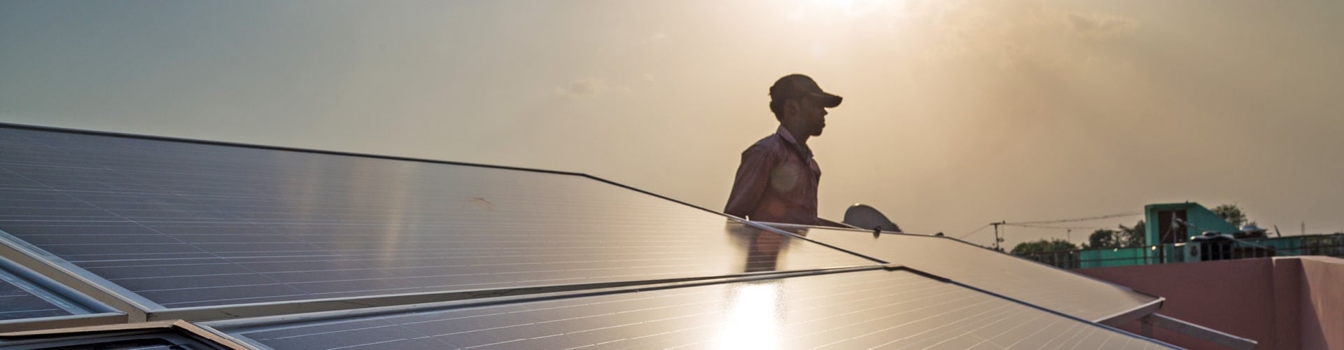 Man installing solar panels