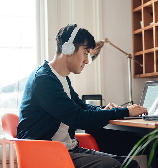 Boy sitting in front of computer