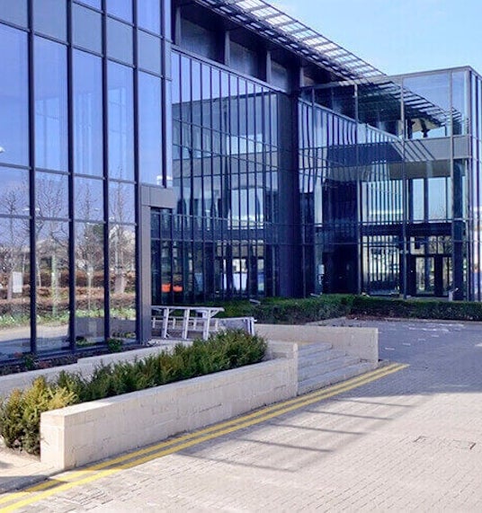 The main entrance to the glass building